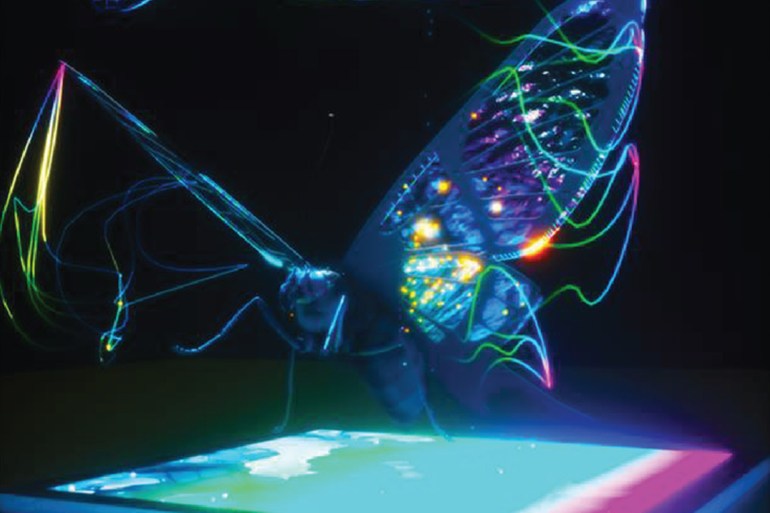 Artistic depiction of a butterfly above the bioinspired imaging sensor. (Image: University of Illinois)