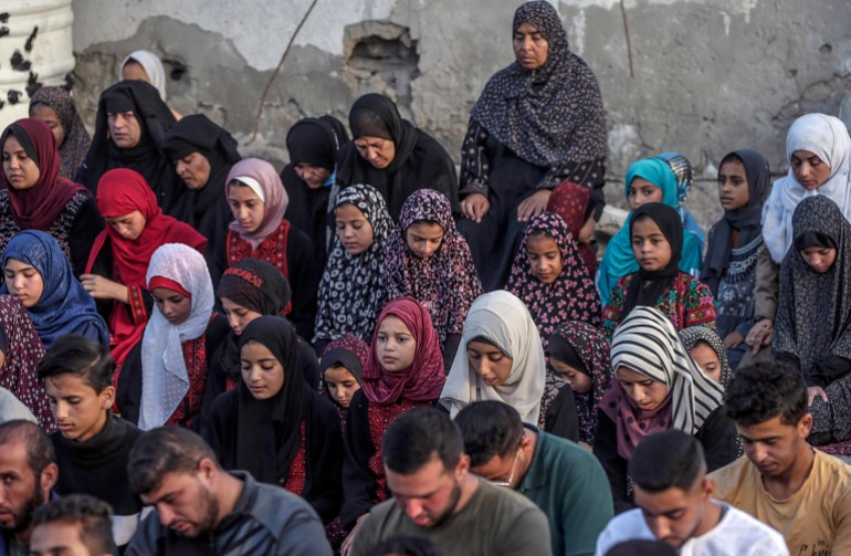 epa11414555 Palestinians attend Eid al-Adha prayer in Khan Younis town, southern Gaza strip, 16 June 2024. Eid al-Adha is the holiest of the two Muslims holidays celebrated each year. It marks the yearly Muslim pilgrimage (Hajj) to visit Mecca, the holiest place in Islam. Muslims slaughter a sacrificial animal and split the meat into three parts, one for the family, one for friends and relatives, and one for the poor and needy. EPA-EFE/MOHAMMED SABER