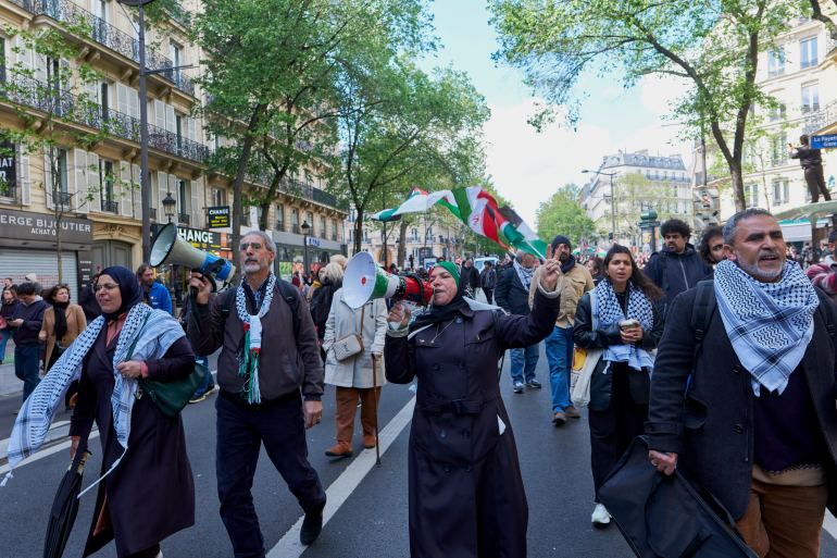 PARIS, FRANCE - APRIL 21: A woman chants slogans in favour of Palestine during a march against racism and Islamophobia on April 21, 2024 in Paris, France. The march was initially banned by authorities because of a potential "danger to public order", but a last-minute appeal by the organisers was granted to allow the march to go ahead. Fifty one organisations, including the far-left La France Insoumise (France Unbowed) party called for people to join the rally, which also includes the denunciation of police violence, especially in France's marginalised urban areas. (Photo by Remon Haazen/Getty Images)