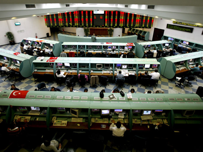 epa01513683 Traders work during the afternoon session at the Stock Exchange in Istanbul, Turkey on 08 October 2008. The Federal Reserve and six other major central banks from around the world slashed interest rates 08 October in an attempt to prevent a financial crisis from becoming a global economic meltdown. EPA/TOLGA BOZOGLU