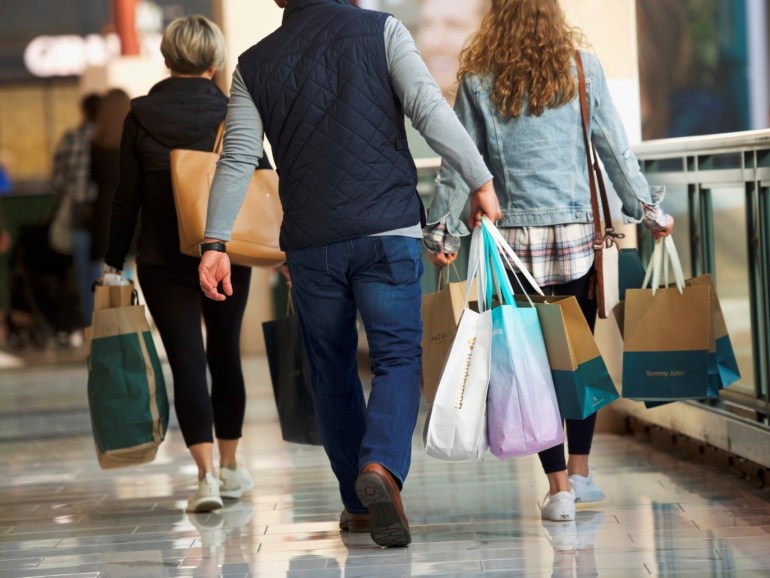 Shoppers carry bags of purchased merchandise at the King of Prussia Mall, United States' largest retail shopping space, in King of Prussia, Pennsylvania, U.S., December 8, 2018. REUTERS/Mark Makela