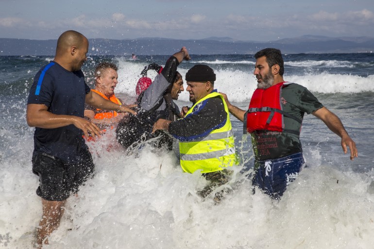 LESBOS, GREECE - OCTOBER 28: A Turkish smuggler is caught after he came too close to Greek shores and was detained by locals who wanted to beat him and eventually handed him over to police on in Lesbos on October 28, 2015. Cold weather and rough seas have done little to stem the endless flow of desperate people fleeing war or poverty trying to get to Europe. More than a million people reached Europe in 2015 in the continent's largest refugee influx since the end of World War II. Nearly all of those entering Greece on a boat from Turkey are from the war zones of Syria, Iraq and Afghanistan. (Photo by Paula Bronstein/ Getty Images)