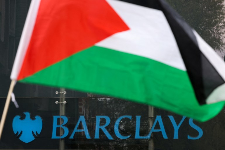 A Palestinian flag flutters as people take part in a pro-Palestinian demonstration outside Barclays Bank, amid the ongoing conflict between Israel and the Palestinian Islamist group Hamas, in London, Britain, April 20, 2024. REUTERS/Hollie Adams