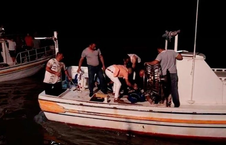 TOPSHOT - Rescuers search for victims and survivors off the coast of Syria's southern port city of Tartus on September 22, 2022, after a boat carrying migrants from Lebanon capsized in the Mediterranean sea. - At least 61 migrants drowned after a boat they boarded in Lebanon sank off Syria's coast, Lebanon's transport minister said on September 23, the deadliest such shipwreck from Lebanon in recent years. Lebanon, which since 2019 has been mired in a financial crisis branded by the World Bank as one of the worst in modern times, has become a launchpad for illegal migration, with its own citizens joining Syrian and Palestinian refugees clamouring for an exit from the crisis-hit country. (Photo by AFP) (Photo by -/AFP via Getty Images)