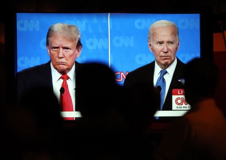 LOS ANGELES, CALIFORNIA - JUNE 27: People watch the CNN presidential debate between U.S. President Joe Biden and Republican presidential candidate former President Donald Trump at a debate watch party at The Continental Club on June 27, 2024 in Los Angeles, California. Biden and Trump are facing off in the first presidential debate of the 2024 presidential cycle. (Photo by Mario Tama/Getty Images)