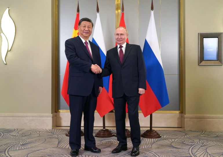 Russian President Vladimir Putin shakes hands with Chinese President Xi Jinping during a meeting on the sidelines of the Shanghai Cooperation Organization (SCO) summit in Astana, Kazakhstan July 3, 2024. Sputnik/Pavel Volkov/Pool via REUTERS ATTENTION EDITORS - THIS IMAGE WAS PROVIDED BY A THIRD PARTY.