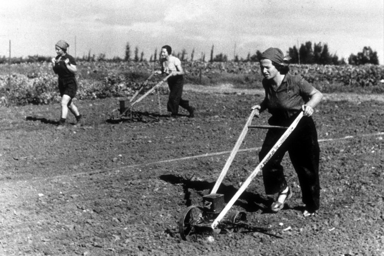 Women hand-plouging fields on a kibbutz in Israel. (Photo by Hulton Archive/Getty Images)