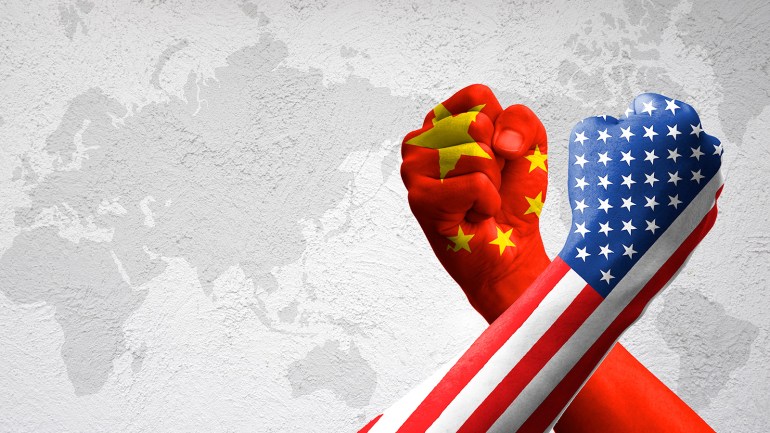 USA and China flag print screen on arm wrestle with world map background.United States of America versus China trade war disputes concept. - Image