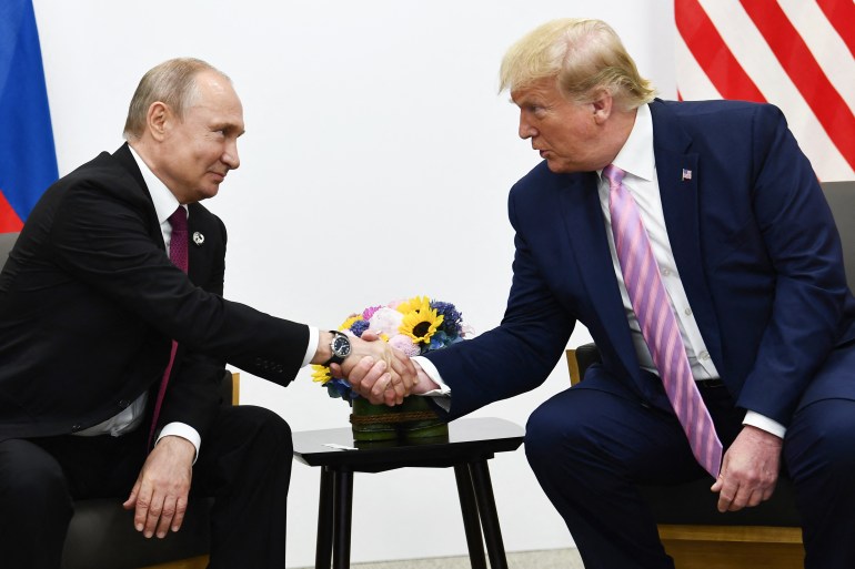 US President Donald Trump (R) attends a meeting with Russia's President Vladimir Putin during the G20 summit in Osaka on June 28, 2019. (Photo by Brendan Smialowski / AFP)