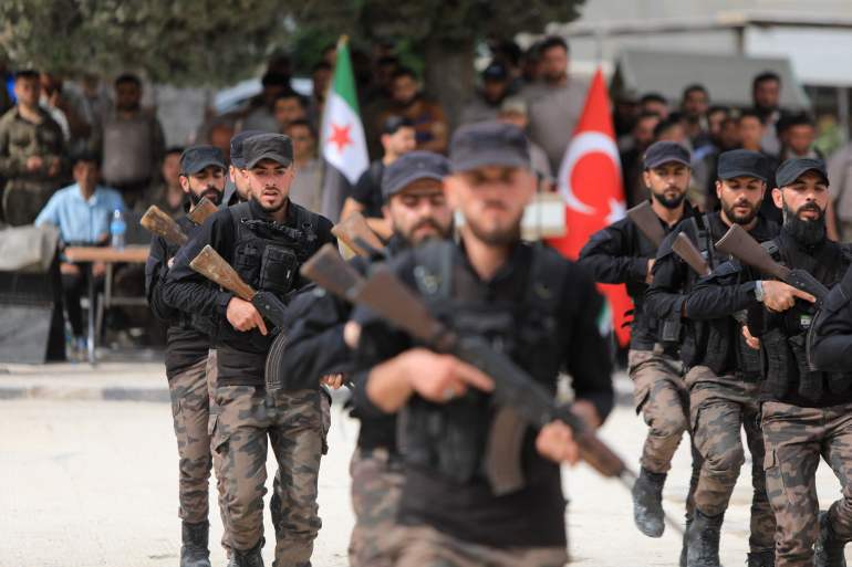 Turkey-backed fighters take part in a graduation ceremony at a Syrian opposition military base in the country's rebel-held northwestern Idlib province, on May 9, 2024. (Photo by Bakr ALKASEM / AFP)