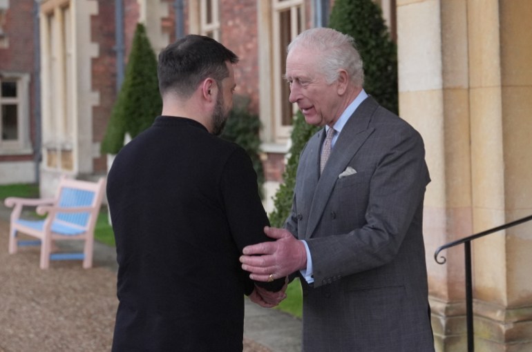 Britain's King Charles III greets Ukraine's President Volodymyr Zelensky on the Sandringham Estate in Norfolk, eastern England, on March 2, 2025. (Photo by Joe Giddens / POOL / AFP)