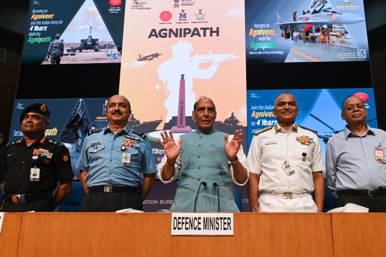 (L-2R) Chief of Indian Army staff General Manoj Pande, Chief of Air staff, Air Chief Marshal Vivek Ram Chaudhari, Indian Defence Minister Rajnath Singh and Chief of Naval Staff Admiral R. Hari Kumar pose for pictures during a press conference in New Delhi on June 14, 2022, to announce the new Agnipath scheme under which soldiers across the three military services will be recruited and will be called Agniveers. (Photo by Money SHARMA / AFP)