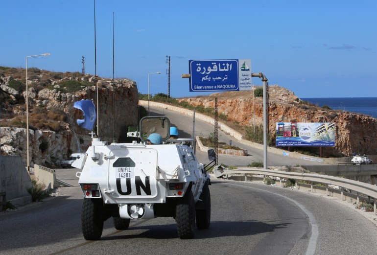 UN peacekeepers (UNIFIL) drive in a vehicle in Naqoura