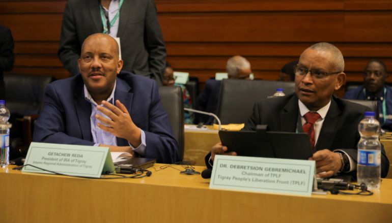 Getachew Reda, President of the Interim Regional Administration of Tigray and Debretsion Gebremichael, Chairman of Tigray People's Liberation Front (TPLF) attend the launch of the report on the Pretoria peace agreement during the 38th Ordinary Session of the Assembly of the Heads of State and Government of the African Union (AU) at the headquarters in Addis Ababa, Ethiopia, February 16, 2025. REUTERS/Tiksa Negeri
