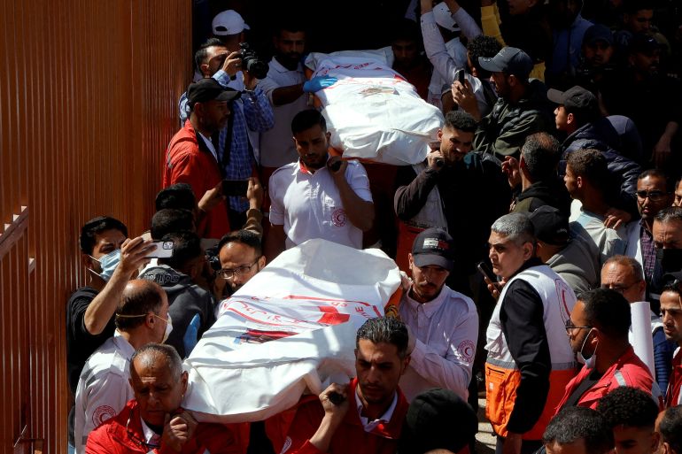 FILE PHOTO: Palestinians mourn medics, who came under Israeli fire while on a rescue mission, after their bodies were recovered, according to the Red Crescent, at Nasser hospital in Khan Younis in the southern Gaza Strip March 31, 2025. REUTERS/Hatem Khaled/File Photo