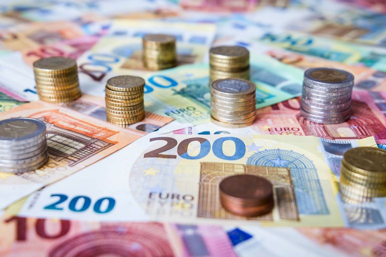 A combination of different Euro banknotes and Euro coins as a closeup