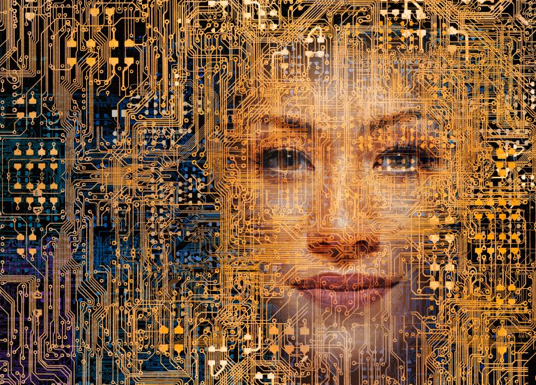 A beautiful woman's face appears within a network of computer circuitry in an image about hackers, security issues, artificial intelligence and the future.