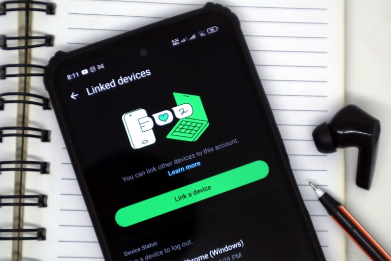 Pacitan, Indonesia - September 20, 2025: The linked devices feature on the WhatsApp application is displayed on Android smartphones.