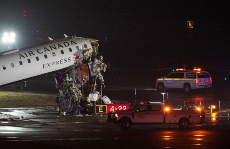 Damage to an Air Canada Express jet that had collided with a ground vehicle at New York's LaGuardia Airport in Queens, New York, U.S. March 23, 2026. REUTERS/Bing Guan
